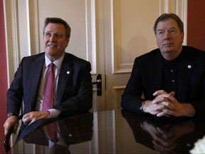FILE - In this Jan. 11, 2012, file photo, United States Olympic Committee Chairman Larry Probst, right, and USOC CEO Scott Blackmun are shown during an interview in London. It took eight years, a nice-sized dose of humble pie and more than a few failures, but Blackmun and Probst succeeded. The International Olympic Committee will award Los Angeles the 2028 Games at a ceremony on Wednesday, Sept. 13, 2017. It will be the first Summer Olympics awarded to the U.S. in 27 years, when the IOC gave the 1996 Games to Atlanta. It will end a string of embarrassing losses: New York for 2012, and Chicago for 2016. (AP Photo/Alastair Grant)
