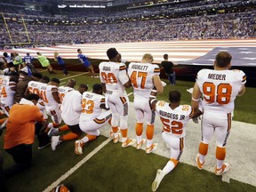 FILE - In this Sunday, Sept. 24, 2017, file photo, members of the Cleveland Browns take a knee during the national anthem before an NFL football game against the Indianapolis Colts in Indianapolis. The NFL says the message players and teams are trying to express is being lost in a political firestorm. NFL spokesman Joe Lockhart said Thursday, Sept. 28, 2017, that it is important for "everyone to understand what they are talking about, to not see everything in terms of who is up or down politically."  (AP Photo/Michael Conroy, File)