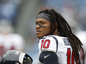 FILE - In this Jan. 1, 2017, file photo, Houston Texans wide receiver DeAndre Hopkins warms up before an NFL football game against the Tennessee Titans in Nashville, Tenn. A person familiar with the negotiations says the Texans and Hopkins have agreed to a five-year, $81 million contract extension. The person spoke to The AP on the condition of anonymity because the deal had not yet been announced by the teams. (AP Photo/Weston Kenney, File)