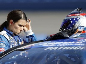 FILE - In this March 24, 2017, file photo, Danica Patrick prepares for the qualifying session for the NASCAR Cup Series auto race at Auto Club Speedway in Fontana, Calif. Aric Almirola announced recently he was leaving Richard Petty Motorsports in 2017, for an unspecified team, though all signs point to him replacing Danica Patrick in the No. 10 at Stewart-Haas Racing.(AP Photo/Alex Gallardo, File)