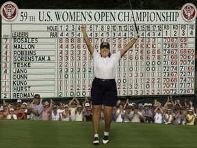 FILE - In this July 4, 2004, file photo, Meg Mallon celebrates after putting out on the 18th green as the winner of the U.S. Women's Open Golf Championship at The Orchards in South Hadley, Mass. Mallon is one of four players to be inducted into the World Golf Hall of Fame (AP Photo/Elise Amendola, File)