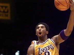 FILE - In this Marcy 28, 1999, file photo, Los Angeles Lakers' Kobe Bryant shoots over New York Knicks' Patrick Ewing during the first half of an NBA basketball game in Inglewood, Calif. The Lakers announced Tuesday, Sept. 12, 2017,  that they will retire Bryant's No. 8 and No. 24 in a ceremony Dec. 18 during their game against Golden State. Bryant wore No. 8 from 1996 to 2006, when he switched to No. 24 for the remainder of his 20-year career with the Lakers. He will be the 10th player honored by the Lakers with a jersey retirement, and the first to have two retired numbers. (AP Photo/Mark J. Terrill, File)