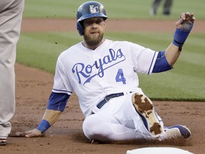 FILE - In this Tuesday, April 18, 2017 file photo, Kansas City Royals' Alex Gordon advances to third base on a fly out by Lorenzo Cain during the first inning of a baseball game against the San Francisco Giants in Kansas City, Mo. Kansas City's Alex Gordon hit Major League Baseball's record 5,694th home run of 2017 on Tuesday night, Sept. 19, 2017 breaking a season record set in 2000 at the height of the Steroids Era. (AP Photo/Charlie Riedel, File)