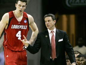 FILE - In this March 29, 2008, file photo, Louisville head coach Rick Pitino talks to David Padgett during an NCAA East Regional final basketball game in Charlotte, N.C. Louisville has named assistant David Padgett as the interim replacement for men's basketball coach Rick Pitino, staying in-house to maintain continuity in the wake of a nationwide federal investigation of college basketball.  (AP Photo/Gerry Broome, File)