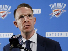 FILE - In this July 12, 2017, file photo, Oklahoma City Thunder general manager Sam Presti answers a question following Paul George's first news conference in Oklahoma City, since the Thunder's blockbuster trade with the Indiana Pacers. The real MVP of the offseason appears to be Presti. The soft-spoken Thunder general manager made blockbuster deals to add Paul George and Carmelo Anthony that immediately put the Thunder in contention to compete with Golden State in the Western Conference.  (AP Photo/Sue Ogrocki, File)