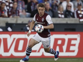 FILE - In this April 15, 2017, file photo, Colorado Rapids forward Kevin Doyle eyes the ball during the first half of an MLS soccer match in Commerce City, Colo. Doyle says he is retiring from professional soccer because of repeated concussions, according to a statement via social media on Thursday, Sept. 27, 2017. Doyle is from Ireland and has played 16 years both in Europe and in Major League Soccer.  (AP Photo/David Zalubowski, File)