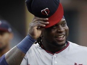 FILE - In this Aug. 1, 2017, file photo, Minnesota Twins' Miguel Sano smiles before a baseball game against the San Diego Padres in San Diego. Sano is coming back just in time for the playoffs. The Twins activated their All-Star third baseman on Friday, Sept. 29, in time for the season's final series against Detroit. Sano has missed 38 games with a stress reaction after fouling a ball off his left shin, and had been on the 10-day disabled list. (AP Photo/Gregory Bull, File)