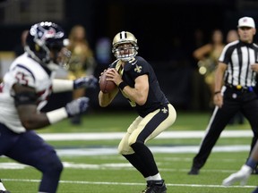 FILE - IN this Aug. 26, 2017, file photo, New Orleans Saints quarterback Drew Brees (9) drops back to pass during the team's preseason NFL football game against the Houston Texans in New Orleans. Brees and the Saints open their season against the Minnesota Vikings. Brees led the NFL in passing yards for a record seventh time in 2016. In five career games against the Vikings, he's 4-1 with a 69 percent completion rate and an average of 294 yards passing per game. He has only thrown four interceptions and taken four sacks. (AP Photo/Bill Feig, File)