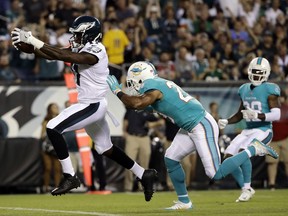 FILE - In this Aug. 24, 2017, file photo, Philadelphia Eagles' Alshon Jeffery, left, scores a touchdown past Miami Dolphins' Nate Allen during the first half of a preseason NFL football game in Philadelphia. Jeffery is looking forward to going against Washington Redskins cornerback Josh Norman, who likes to talk trash. He has 11 catches for 189 yards and a touchdown in two games against Norman. (AP Photo/Matt Rourke, File)
