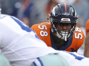 FILE - In this Sunday, Sept. 17, 2017, file photo, Denver Broncos outside linebacker Von Miller eyes Dallas Cowboys quarterback Dak Prescott during the first half of an NFL football game in Denver. Miller gets the top billing in The Associated Press rankings of the NFL's best outside linebackers. Miller received nine of a possible 11 first-place votes to easily outdistance the field.  (AP Photo/Jack Dempsey, File)