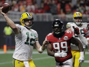 FILE - In this Sunday, Sept. 17, 2017, file photo, Green Bay Packers quarterback Aaron Rodgers (12) throws a pass against the Atlanta Falcons during the first of an NFL football game in Atlanta. Injuries that could leave the Packers without several key players may help the Cincinnati's chances of digging out from an 0-2 start. But, two-time NFL MVP quarterback Aaron Rodgers represents the great equalizer, capable of winning any game regardless of the circumstances. (AP Photo/David Goldman, File)