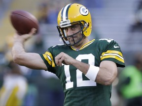 FILE - In this Aug. 31, 2017, file photo, Green Bay Packers' Aaron Rodgers warms up before a preseason NFL football game against the Los Angeles Rams, in Green Bay, Wis. The Green Bay Packers head into the season with familiar expectations as a favorite again to win the NFC North and get to the Super Bowl. Goals will always be set high especially with quarterback Aaron Rodgers in his prime. (AP Photo/Jeffrey Phelps, File)