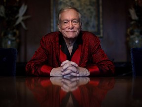 FILE - In this Nov. 4, 2010, file photo, Playboy magazine founder Hugh Hefner poses for photos at the Playboy Mansion in Los Angeles. The Playboy magazine founder and sexual revolution symbol Hefner has died at age 91. The magazine released a statement saying Hefner died at his home of natural causes on Wednesday night, Sept. 27, 2017, surrounded by family. (AP Photo/Jae C. Hong, File)