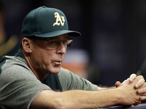 FILE - In this June 9, 2017, file photo, Oakland Athletics manager Bob Melvin watches the first inning of a baseball game against the Tampa Bay Rays in St. Petersburg, Fla. Melvin is set to manage at least two more years for the Athletics, with his latest extension announced Thursday, Sept. 28, 2017, set to take him through the 2019 season. (AP Photo/Chris O'Meara, File)