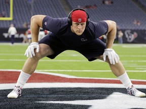 FILE - In this Aug. 19, 2017, file photo, Houston Texans defensive end J.J. Watt warms up before an NFL football preseason game against the New England Patriots in Houston. Watt has not played since Sept. 22, 2016, after missing the final 13 games of last season following his second back surgery. (AP Photo/David J. Phillip, File)