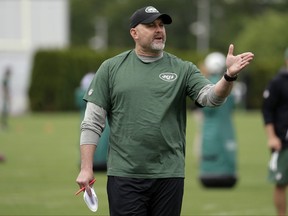 FILE - In this May 23, 2017, file photo, New York Jets offensive coordinator John Morton talks to his team during the team's organized team activities at its NFL football training facility in Florham Park, N.J. Morton is prepared to tackle what is widely considered one of the toughest tasks in the NFL this season: making the Jets competitive on offense. (AP Photo/Julio Cortez, File)