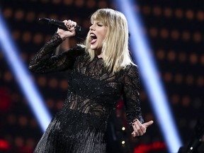 FILE - In this Feb. 4, 2017, file photo, Taylor Swift performs at the DIRECTV NOW Super Saturday Night Concert in Houston, Texas. Billboard announced Tuesday, Sept. 5, 2017, that Swift's new single "Look What You Made Me Do" has topped its Hot 100 chart, unseating "Despacito" from the No. 1 spot after 16 weeks. Swift's song denied the song by Luis Fonsi and Daddy Yankee from breaking a record set by Mariah Carey and Boyz II Men for the longest son atop the Hot 100 chart. (Photo by John Salangsang/Invision/AP, File)