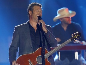 FILE - In this June 7, 2017, file photo, Blake Shelton performs "Every Time I Hear that Song" at the CMT Music Awards at Music City Center in Nashville, Tenn. Shelton, Beyonce, Barbra Streisand and Oprah Winfrey will headline a one-hour benefit telethon to benefit Hurricane Harvey victims that will be simulcast Sept. 12 on ABC, CBS, NBC, Fox and CMT. (Photo by Wade Payne/Invision/AP, File)
