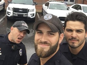 In this Sunday, Sept. 10, 2017, photo provided by the Gainesville Police Department, three members of the department take a selfie in Gainesville, Fla. The photo was widely-shared on social media after the department posted it to Facebook with comments praising the officers good looks. (Gainesville Police Department via AP)
