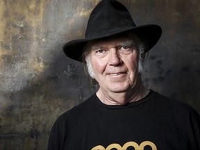 FILE - In this May 18, 2016 file photo, Neil Young poses for a portrait in Calabasas, Calif. Young's lost 1976 acoustic record 'Hitchhiker' uncovers previously unreleased tracks, versions of songs later to become standards. (Photo by Rich Fury/Invision/AP, File)