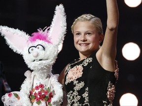 This Wednesday, Sept. 20, 2017 photo shows Darci Lynne Farmer on "America's Got Talent" in Los Angeles. The 12-year-old girl is getting a $1 million prize and her own Las Vegas show after taking the "America's Got Talent" crown on the season 12 finale of the NBC reality competition Wednesday. (Trae Patton/NBC via AP)