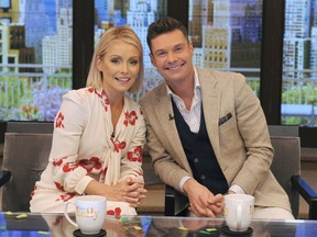 FILE - In this Monday, May 1, 2017, file photo, released by Disney/ABC Home Entertainment and TV Distribution, Kelly Ripa and Ryan Seacrest pose for a photo at "Live" in New York. On Monday, Sept. 4, "Live with Kelly and Ryan" launches a new season, its 30th in national syndication. (Pawel Kaminski/Disney/ABC Home Entertainment and TV Distribution via AP)