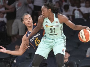 File - In this July 19, 2017, file photo, New York Liberty center Tina Charles (31) drives to the basket against Connecticut Sun forward Alyssa Thomas (25) during the first half of a WNBA basketball game, at Madison Square Garden in New York. The Liberty earned the three-seed in the WNBA playoffs by defeating Dallas on Sunday, Sept. 3, 2017, and matched a franchise record with a 10th straight win. (AP Photo/Mary Altaffer, File)