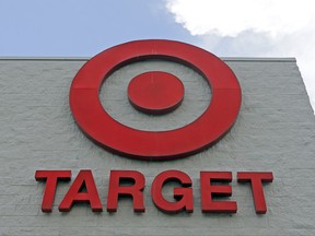 FILE - This Wednesday, June 29, 2016, file photo, shows a Target store in Hialeah, Fla. Target Corp. is raising its minimum hourly wage for its workers to $11 starting in October 2017 and then to $15 by the end of 2020 in a move it says will help it better recruit and retain staff and provide a better shopping experience for its customers. (AP Photo/Alan Diaz, File)