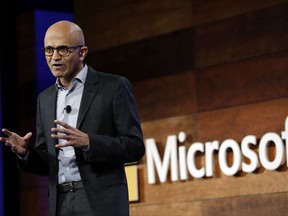 FILE - In this Wednesday, Nov. 30, 2016, file photo, Microsoft CEO Satya Nadella speaks at the annual Microsoft shareholders meeting, in Bellevue, Wash. Nadella has written an autobiography recounting his efforts to transform the technology company with a focus on empathy and changing its workplace culture. The book, "Hit Refresh," also reveals some personal challenges, such as his risky move to switch his green card to a temporary work visa in the 1990s so that his wife could join him in the United States. (AP Photo/Elaine Thompson, File)
