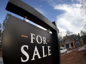 FILE - In this Thursday, Dec. 3, 2015, file photo, a home under construction and for sale is shown in Roswell, Ga. U.S. home prices climbed steadily in July 2017 even as sales have slowed, evidence that a limited supply of available houses is distorting the real estate market. (AP Photo/John Bazemore, File)