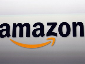 FILE - This Sept. 6, 2012, file photo shows the Amazon logo in Santa Monica, Calif. Amazon unveils new devices, Wednesday, Sept. 27, 2017. (AP Photo/Reed Saxon, File)