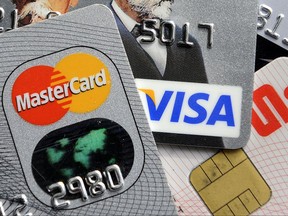 FILE - This Nov. 18, 2009, file photo, shows credit and bank cards. On Friday, Sept. 8, 2017, the Federal Reserve releases its July report on consumer borrowing. (AP Photo/Martin Meissner, File)