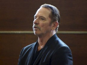 FILE- In this still image taken Aug. 3, 2017 from video, actor Tom Wopat stands during arraignment, in Waltham, Mass., on indecent assault and battery and drug possession charges. The former star of the 1980s television show "The Dukes of Hazzard" who's accused of groping a female cast member of a musical he was supposed to appear in now faces charges he indecently assaulted a 16-year-old girl in Massachusetts. Court records show Wopat is charged with assaulting the girl and a woman in July while rehearsing for the musical "42nd Street" at the Waltham-based Reagle Music Theatre of Greater Boston. The Boston Globe reports the charges were made public Tuesday, Sept. 26. (WCVB-TV via AP, Pool, File )