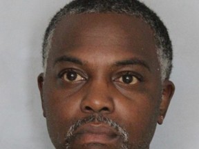 This booking photo provided by the Delaware State Police shows Calvin Davis. Police in Delaware say two daycare workers prevented Davis from walking out with two infants he grabbed. State Police said early Friday, Davis pushed a worker at Happy Kids Academy in the face to enter the facility. Sgt. Richard Bratz, an agency spokesman, says the man went to the infant room, punched another worker in the face, and picked up two infants. Bratz said Davis will be charged with kidnapping, assault and other offenses. (Delaware State Police via AP)