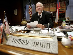FILE - In this Jan. 28, 2009 file photo, then Georgia Commissioner of Agriculture Tommy Irvin works at his desk in Atlanta. Irvin, whose four decades in office made him one of the longest-serving statewide officials in U.S., died at the age of 88, the department he once ran confirmed Friday, Sept. 15, 2017. First appointed as state agriculture head in 1969 by then-Gov. Lester Maddox, Irvin went on to win 10 consecutive elections before deciding to retire in 2011 because of age and health reasons.  (AP Photo/John Bazemore, File)