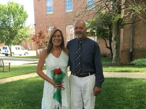 In this July 7, 2017 photo provided by Diane Tippett,  Diane Tippett poses with her husband Robbie after their wedding ceremony, on the lawn of the courthouse in Leonardtown, Maryland. Last October Lucey came to Georgetown Lombardi Comprehensive Cancer Center with a salivary gland cancer that had spread to her liver and lungs. Lucey received Opdivo, one of a wave of new drugs that help the immune system see and fight cancer. "I don't feel any different than you do. I'm not tired, I've got all my hair," she said. "I want more people to know about it and to ask their doctors about it," she said of immunotherapy and the testing that led her to it. (Diane Tippett via AP)