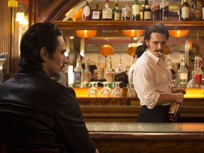 This image released by HBO shows James Franco portraying twins Vincent and Frankie Martino in, "The Deuce," a new HBO series about Times Square in the early 1970s. (HBO via AP)