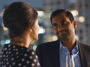 This image released by Netflix shows Aziz Ansari in a scene from, "Master of None."  Ansari is nominated for an Emmy Award for outstanding lead actor in a comedy series, the sole Asian-American acting nominee. (Netflix via AP)