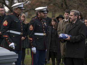 This image released by Lionsgate shows Laurence Fishburne, from left, Bryan Cranston and Steve Carell in a scene from Last Flag Flying." (Wilson Webb/Lionsgate via AP)
