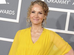 FILE - In a Sunday, Feb. 10, 2013 file photo, singer Joan Osborne arrives at the 55th annual Grammy Awards, in Los Angeles. The Grammy-nominated singer of the hit "One of Us" has put together an album of her unique takes on 13 of his classic songs. (Photo by Jordan Strauss/Invision/AP, File)