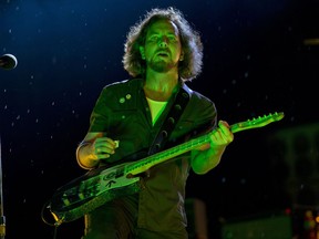 FILE - In this Sept. 2, 2012 file photo, Eddie Vedder of Pearl Jam performs at the "Made In America" music festival in Philadelphia. In the new documentary "Let's Play Two," the bands two concerts at Wrigley Field  became the soundtrack for the Chicago Cubs ending their 108-year World Series drought, tied together by band frontman Eddie Vedder, a lifelong Cub fan.(Photo by Drew Gurian/Invision/AP, File)