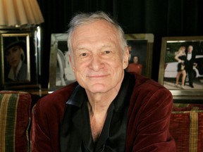 FILE - In this April 7, 2006 file photo, Playboy founder Hugh Hefner is photographed at the Playboy Mansion in the Holmby Hills area of Los Angeles. Hefner has died at age 91. The magazine released a statement saying Hefner died at his home of natural causes Wednesday night, Sept. 27, 2017, surrounded by family. (AP Photo/Kevork Djansezian, File)
