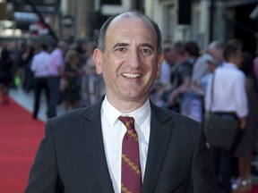 FILE - In this July 24, 2013 file photo, Armando Iannucci arrives at the London Premiere of "Alan Partridge: Alpha Papa" at a central London cinema. Iannucci is  premiering his second feature film, "The Death of Stalin," Friday, Sept. 8, 2017, at the Toronto International Film Festival.  (Photo by Joel Ryan/Invision/AP, File)