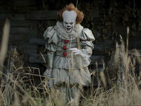 This image released by Warner Bros. Pictures shows Bill Skarsgard in a scene from "It." (Warner Bros. Pictures via AP)