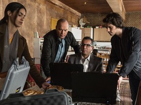 This image released by Lionsgate shows, from left, Shiva Negar, Michael Keaton, Neg Adamson and Dylan O'Brien in a scene from, "American Assassin." (Christian Black/Lionsgate via AP)