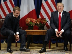 President Donald Trump jokes with French President Emmanuel Macron during a meeting at the Palace Hotel during the United Nations General Assembly, Monday, Sept. 18, 2017, in New York. (AP Photo/Evan Vucci)