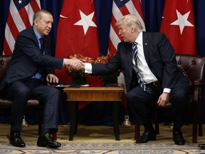 President Donald Trump shakes hands with Turkish President Recep Tayyip Erdogan during a meeting at the Palace Hotel during the United Nations General Assembly, Thursday, Sept. 21, 2017, in New York. (AP Photo/Evan Vucci)