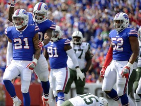 Buffalo Bills' Jordan Poyer (21) celebrates with teammates after sacking New York Jets quarterback Josh McCown (15) during the first half of an NFL football game Sunday, Sept. 10, 2017, in Orchard Park, N.Y. (AP Photo/Adrian Kraus)