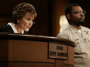 FILE - In this Feb. 2, 2006, file photo, Judge Judy Sheindlin presides over a case as her bailiff Petri Hawkins Byrd listens on the set of her syndicated show "Judge Judy" at the Tribune Studios in Los Angeles. Sheindlin, better known as Judge Judy, is funding a space for public debate at the University of Southern California. The forum, which was to be unveiled Tuesday night, Sept. 12, 2017, will host the USC Annenberg Debate Series. (AP Photo/Damian Dovarganes, File)