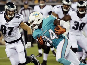 FILE - In this Aug. 24, 2017, file photo, Miami Dolphins' Lawrence Timmons returns an interception during the first half of a preseason NFL football game against the Philadelphia Eagles in Philadelphia. Miami lifted the suspension of Lawrence Timmons after one week Tuesday, Sept. 26, and he's eligible to play Sunday against the New Orleans Saints in London, two people familiar with the decision said. (AP Photo/Matt Rourke, File)